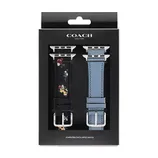 Coach New York Apple Watch bands set, featuring one with a floral design on black and another in solid blue, packaged in a branded black box.