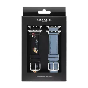 Coach New York Apple Watch bands set, featuring one with a floral design on black and another in solid blue, packaged in a branded black box.