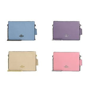 Four colorful clutch bags displayed in blue, purple, beige, and pink, each with scalloped edges and a metallic logo.