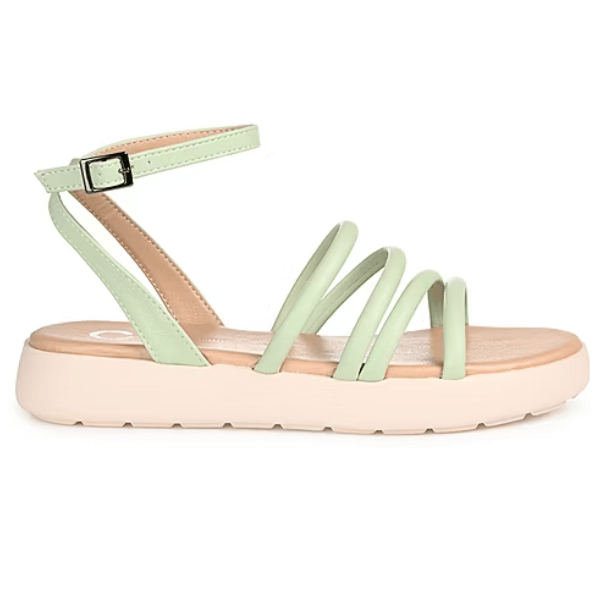 A light green strappy sandal with a buckle ankle strap and cushioned beige sole featuring a low platform design.