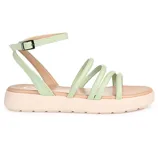 A light green strappy sandal with a buckle ankle strap and cushioned beige sole featuring a low platform design.