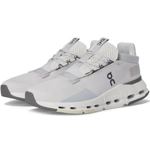 Light gray athletic shoes with a sleek, modern design featuring the On logo, breathable perforated upper, and CloudTec cushioning. They have a lace-up closure and a gray and white sole.