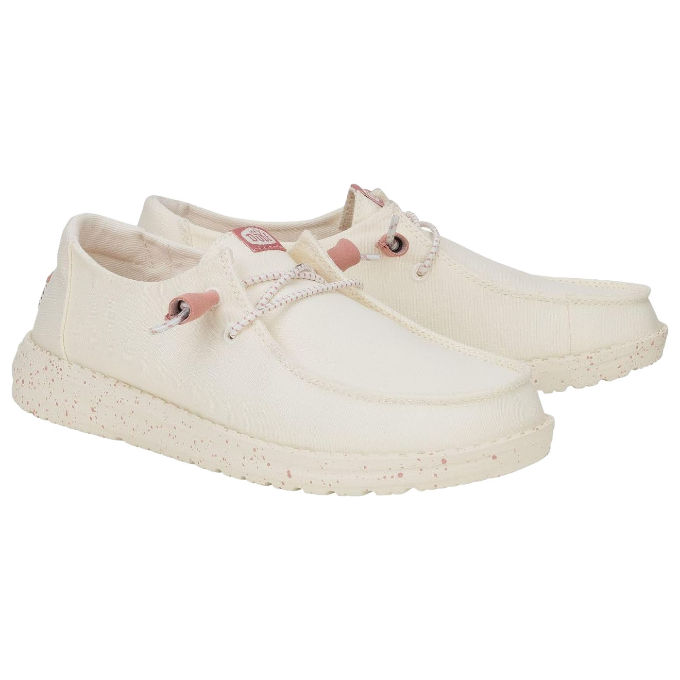 Cream-colored casual shoes with speckled soles, lace-up design, and pink accents.