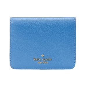 A blue leather Kate Spade New York wallet featuring gold logo lettering on the front.