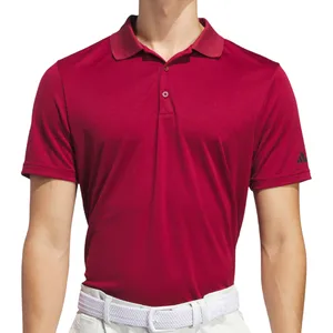 A maroon short-sleeve polo shirt with a collar and button placket, featuring an Adidas logo on the sleeve. Paired with white pants and a white woven belt.