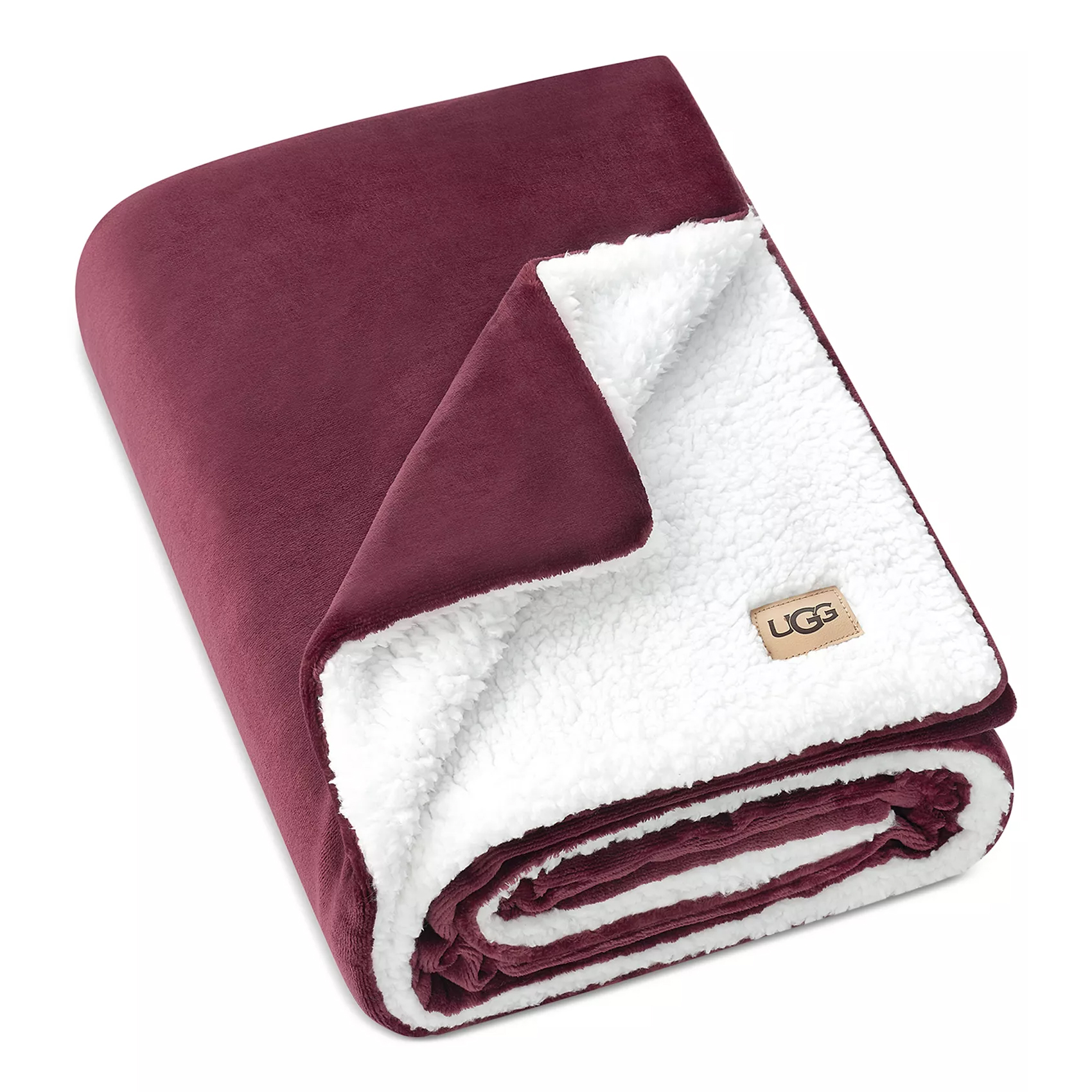 A maroon and white UGG blanket featuring a plush, velvety exterior and a soft sherpa interior.