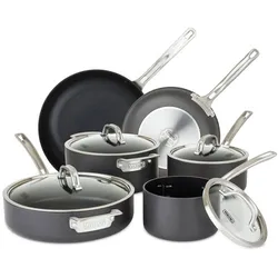 Cookware set including two frying pans and four lidded pots, all in non-stick, dark material with stainless steel handles.
