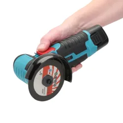 A person holds a cordless angle grinder with a blue and black handle, equipped with a 3-inch metal cutting disc.