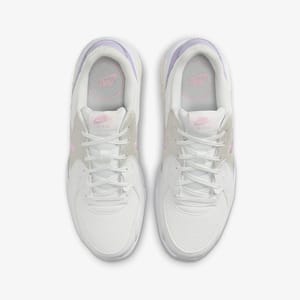 A pair of white sports shoes with pink and purple accents, featuring a mesh upper and cushioned soles.