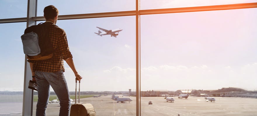 man with luggage at airport