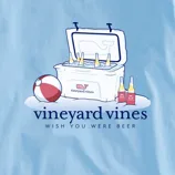 A cooler full of beer bottles next to a beach ball, with the Vineyard Vines logo and the phrase \“Wish You Were Beer\“ on a light blue background.