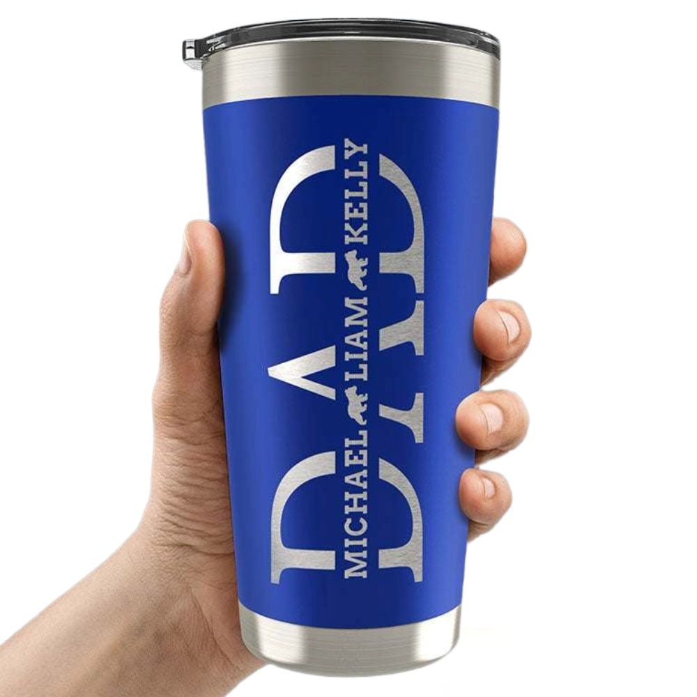 A blue travel tumbler with a silver lid is being held. The design features the word \“DAD\“ vertically, with names \“MICHAEL LIAM KELLY\“ interspersed and small bear silhouettes.