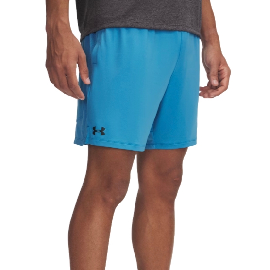 Blue athletic shorts with an Under Armour logo on the left leg, worn by a person standing in a relaxed pose.