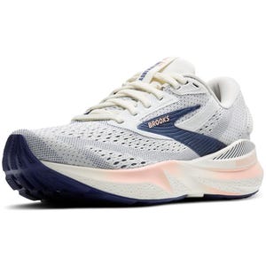 The Brooks Adrenaline GTS 24 shoes feature a sleek white mesh upper with navy accents, designed for running with added support and cushioning. They have a durable outsole for traction and stability.
