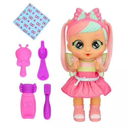 a baby doll wearing a pink dress besides accessories like a bottle and toothbrush