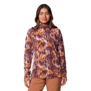Women's Columbia Half-Zip Fleece with a colorful, abstract pattern in purple, orange, and white, featuring a high collar and long sleeves, paired with brown pants.