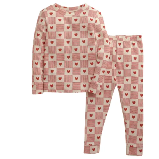 Two-piece kids' pajamas featuring a red and white checkered pattern with heart designs, including a long-sleeve top and matching bottoms.