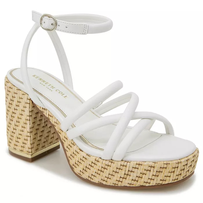 Kenneth Cole Women's Daphne Sandals feature white straps with an adjustable ankle buckle and a woven straw-textured block heel and platform, offering a stylish and summery look.