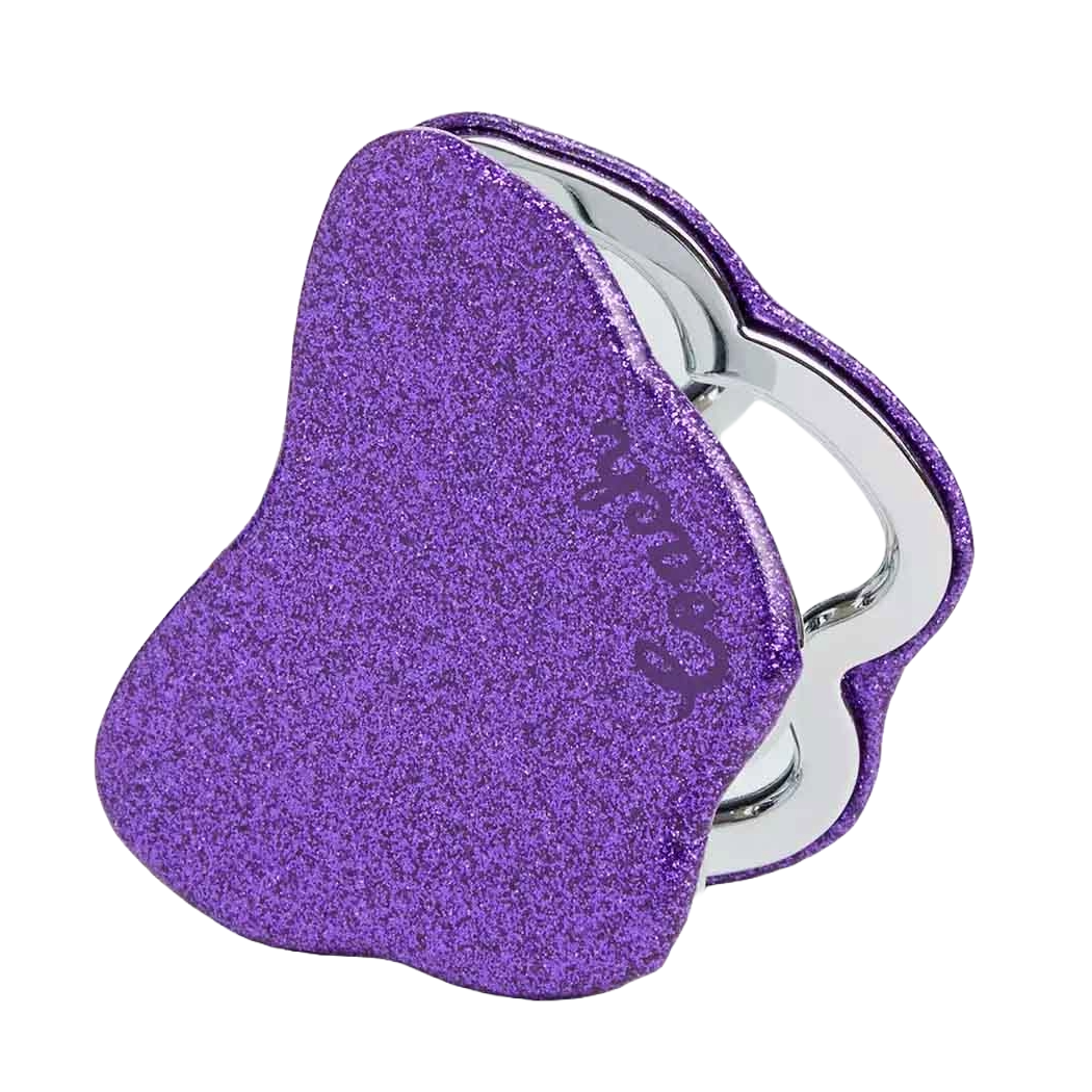 Purple heart-shaped glitter compact mirror with a shiny silver edge, featuring the Coach logo subtly embossed. Ideal for on-the-go touch-ups.