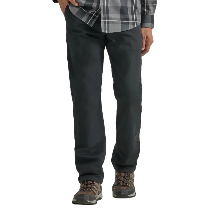 Wrangler Men's Outdoor Chino Pants are black, straight-leg trousers paired with a plaid button-up shirt and brown hiking shoes, suitable for casual or outdoor wear.
