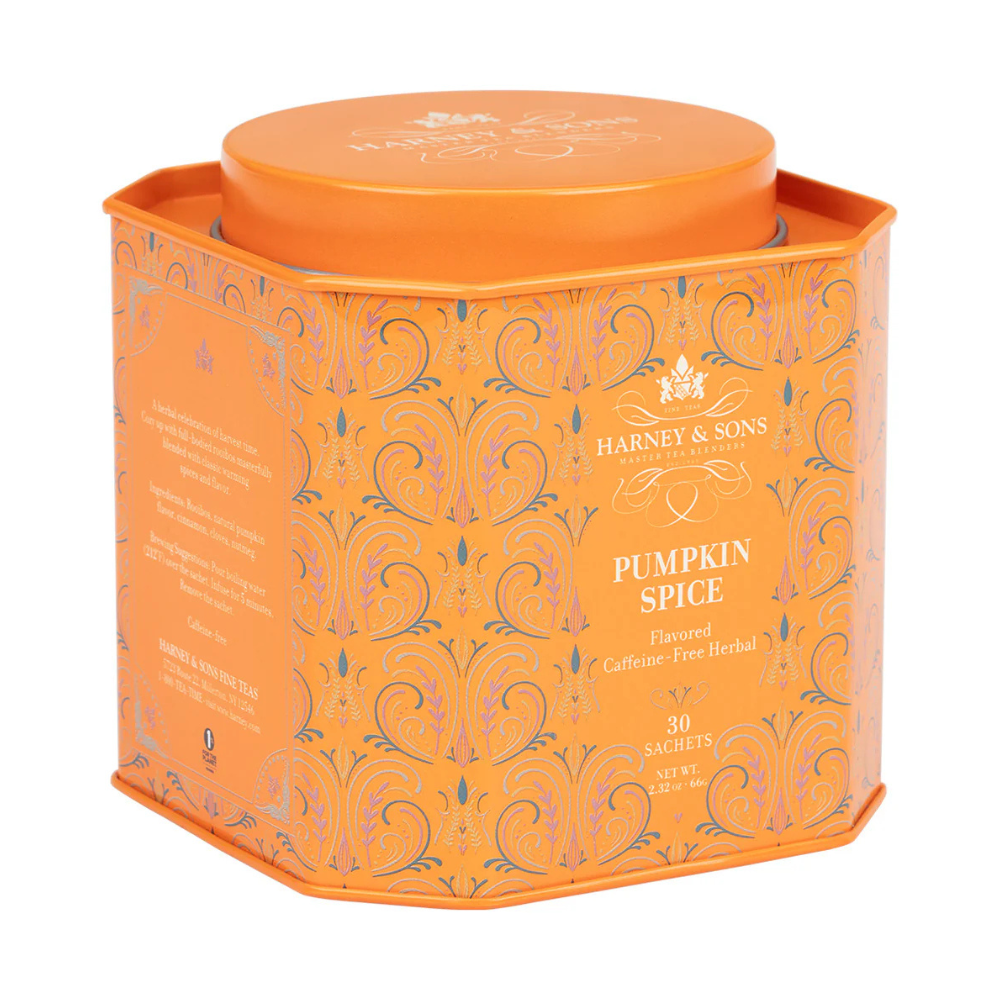 Orange tin of Harney & Sons Pumpkin Spice tea, containing 30 caffeine-free herbal sachets. The design features ornate patterns with the brand's logo.