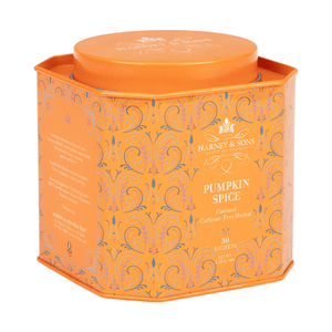 Orange tin of Harney & Sons Pumpkin Spice tea, containing 30 caffeine-free herbal sachets. The design features ornate patterns with the brand's logo.