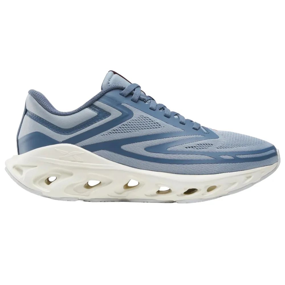 Running shoe with a blue mesh upper and a unique white midsole featuring large cutouts for cushioning and design.