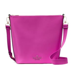 Bright pink Kate Spade crossbody bag with an adjustable strap and brand logo on the front.