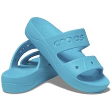 Light blue Crocs sandals featuring a platform heel and a single strap across the top with circular perforations.
