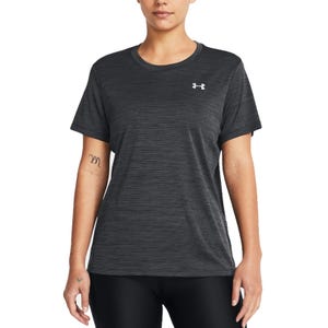 A person wearing a dark gray short-sleeve Under Armour athletic shirt featuring a small logo on the chest. They have a subtle tattoo on their arm.