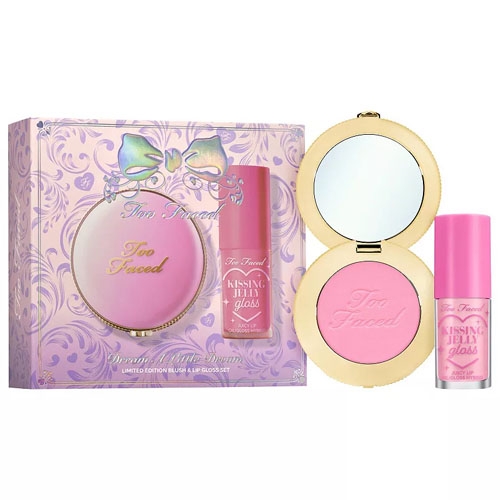 Too Faced makeup set featuring a limited edition blush in a compact with a mirror and a \“Kissing\“ liquid lip gloss, packaged in a decorative box.