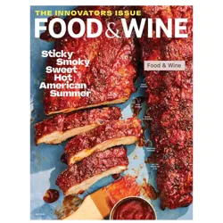 Food & Wine magazine cover featuring saucy, sliced ribs with text describing the preparation as \“sticky, smoky, sweet, hot\“ and detailing the process: spice-rubbed, oven-cooked, sauce-slathered, and charcoal-finished.