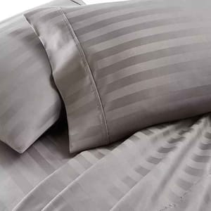 Gray Cali King 1,000TC cotton sheet set featuring subtle vertical stripes; includes pillowcases and a fitted sheet for a luxurious look and feel.