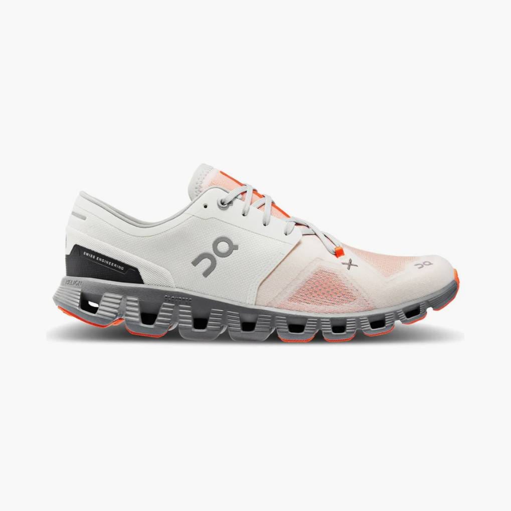 A single white and orange running shoe with a distinctive thick, black cushioned sole.