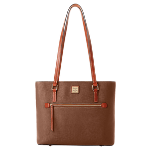 A brown leather Dooney & Bourke tote bag with a pebbled texture, featuring a front zipper pocket, two long shoulder straps, and a branded patch.