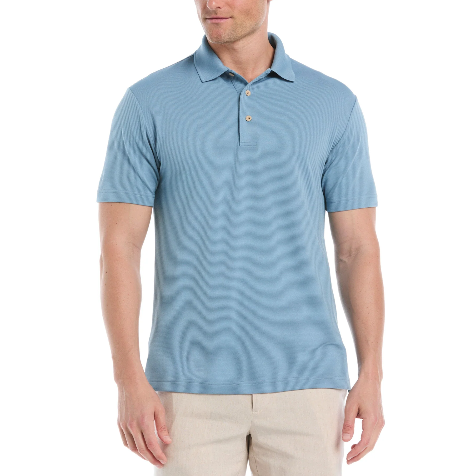 A man is wearing a light blue short-sleeve polo shirt with beige pants. The polo has a classic collar and two buttons.