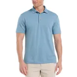 A man is wearing a light blue short-sleeve polo shirt with beige pants. The polo has a classic collar and two buttons.