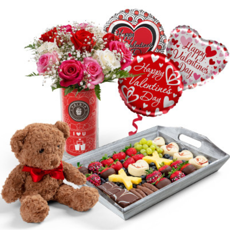 The Forever & Always Gift Set includes a bouquet of mixed roses, a teddy bear with a red bow, heart-themed Valentine's Day balloons, and a tray of chocolate-covered fruits and treats.