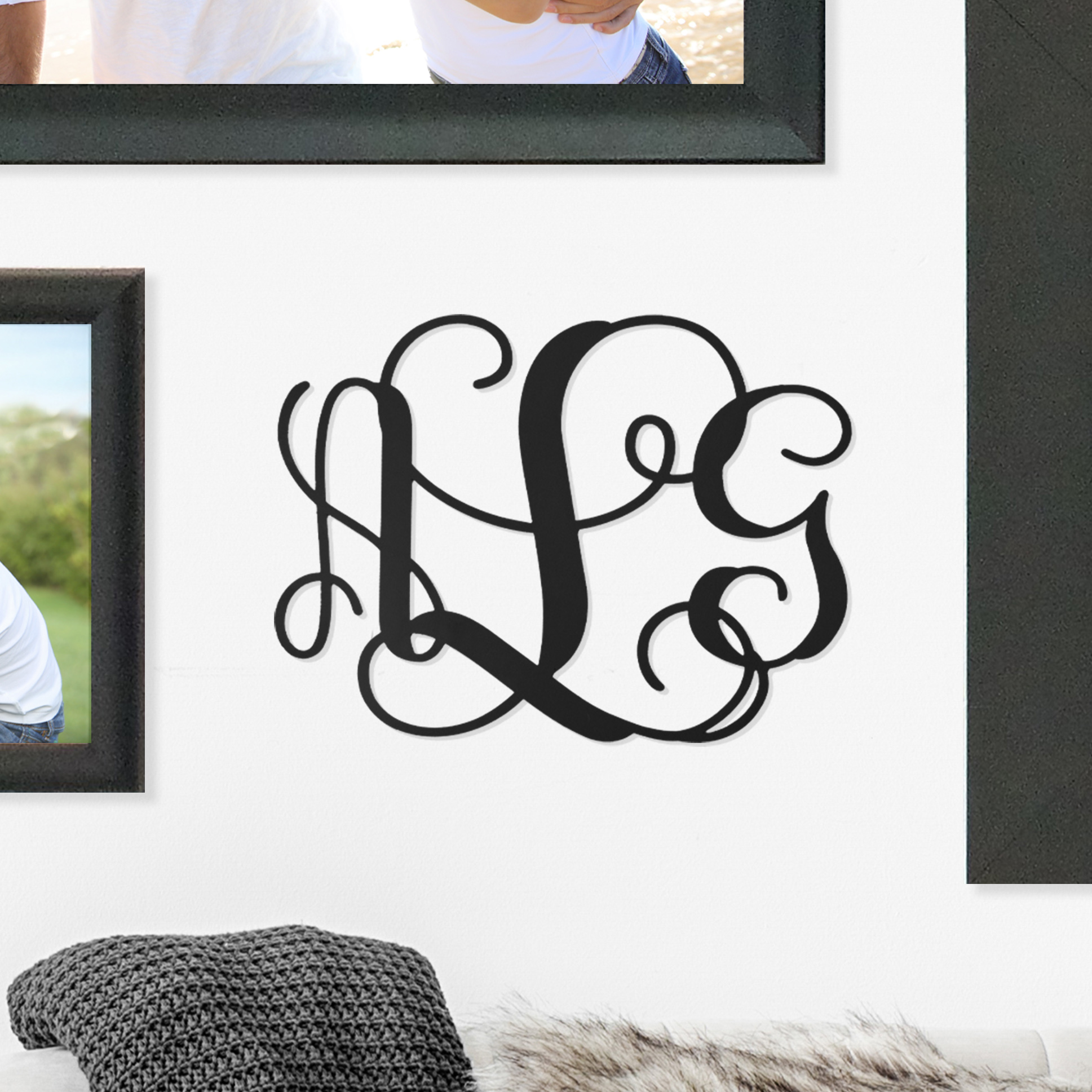 Decorative monogram decal on a wall.