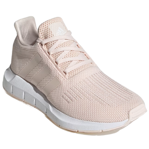 Light pink athletic sneaker with a mesh upper and three side stripes, featuring a white cushioned sole.