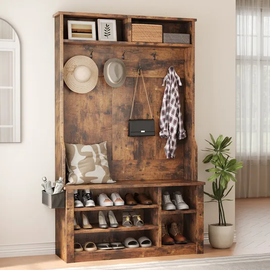 A rustic wooden entryway bench with shoe storage, hooks for hats and coats, and upper cubbies for additional storage. Accessories include shoes, hats, a bag, an umbrella holder, and a decorative plant.