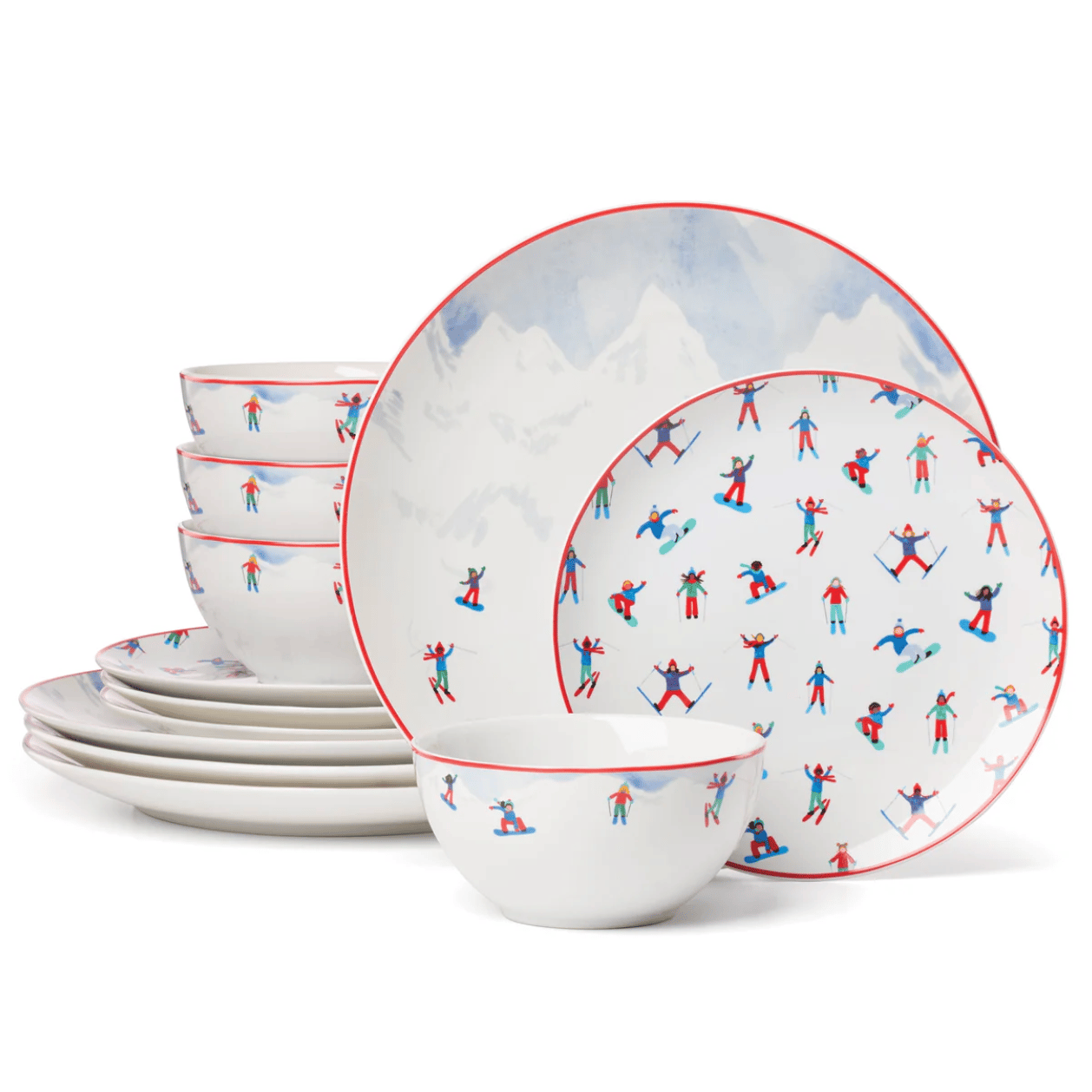 A set of dinnerware featuring plates and bowls with a colorful skier and snowboarder pattern, outlined in red.