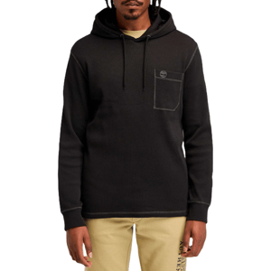 A black hooded sweatshirt with a pocket and subtle logo detail on the chest, paired with beige pants featuring graphics along the leg.