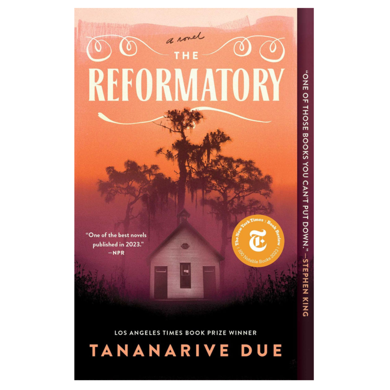 Cover of the novel \“The Reformatory\“ by Tananarive Due, featuring a small building against a backdrop of trees with accolades from NPR and The New York Times.