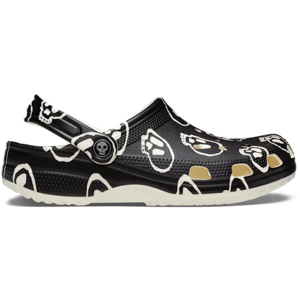 Black clogs featuring a glow-in-the-dark skulls pattern, with a rotating heel strap and ventilation holes.
