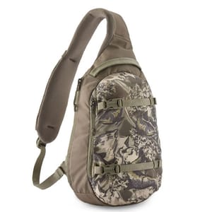 A camouflage-patterned sling backpack with padded shoulder strap, multiple compartments, and adjustable straps for securing gear.
