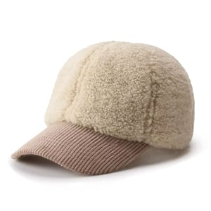 A beige baseball cap featuring a soft, fluffy fleece crown and a ribbed, slightly curved brim in a matching tone, designed for warmth and style.