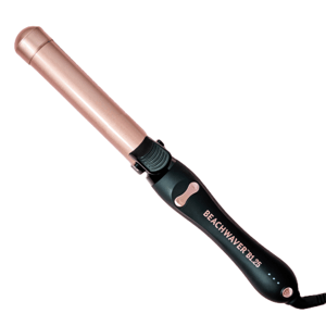 A Beachwaver B1.25 curling iron with a rose gold barrel and black handle, featuring a rotating clamp and control buttons for easy styling.