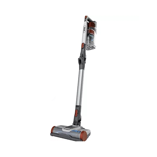 Cordless stick vacuum cleaner with a sleek gray and red design, featuring a transparent dustbin and a low-profile cleaning head.