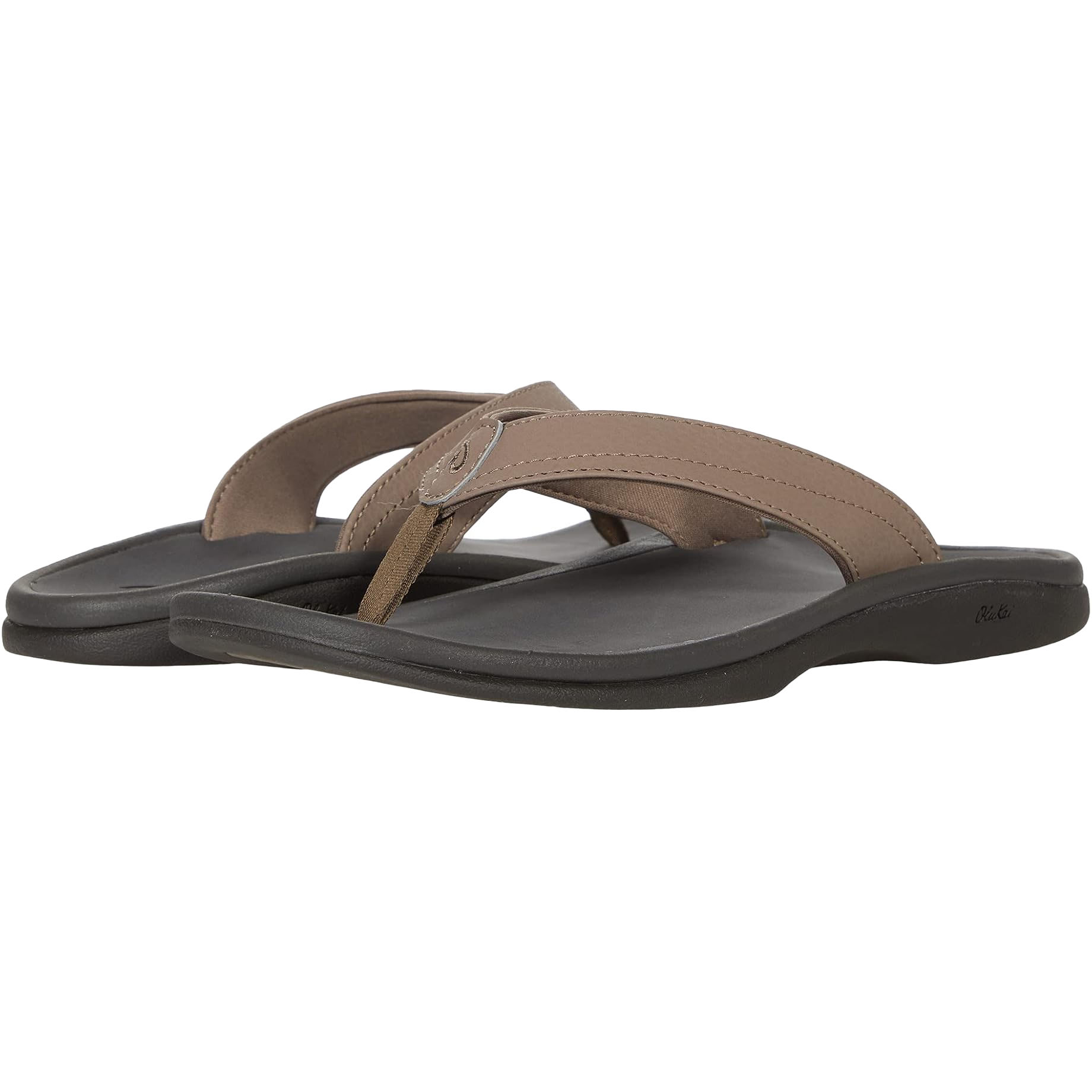 Brown flip-flop sandals with wide straps and black soles, featuring a small metallic logo detail on the strap.